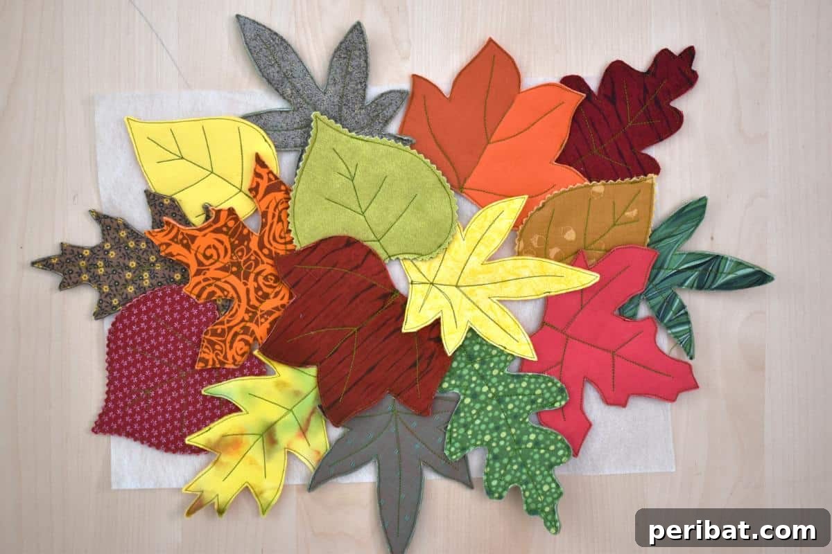 Hand-sewn fabric fall leaf decorations, including garlands, trivets, and table runners, in autumn colors, creating a cozy and festive ambiance.