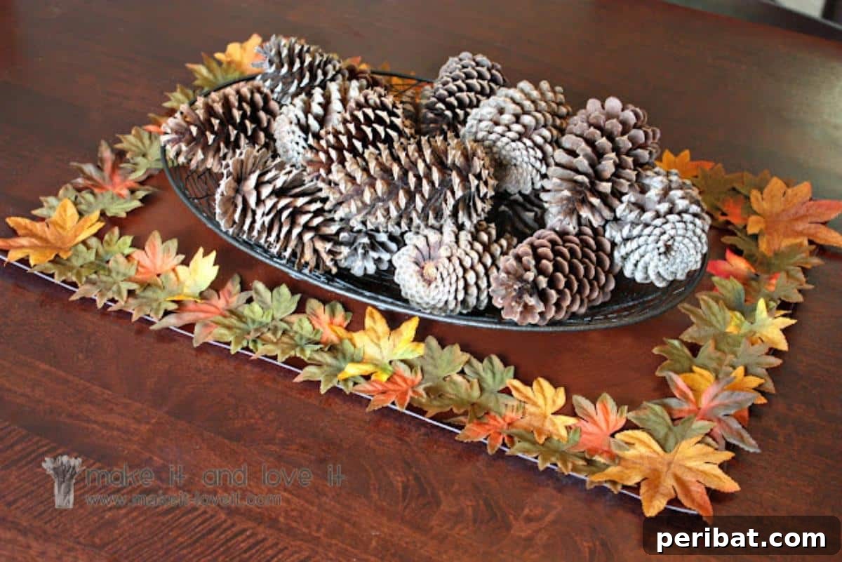 A festive autumn table runner adorned with silk leaves and other seasonal elements, perfect for enhancing a dining space during fall gatherings.