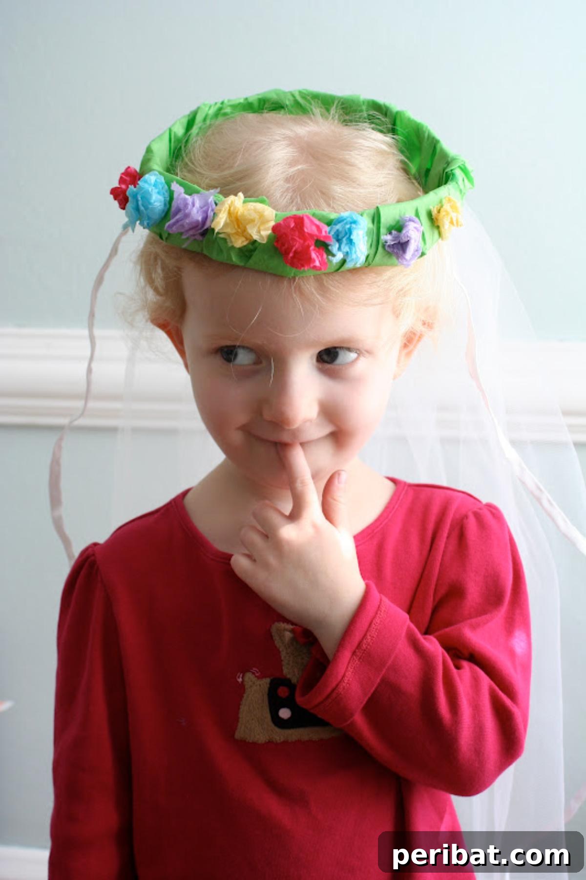 Vibrant Tissue Paper Crafts: 40 DIY Ideas 17 Spring Tissue Paper Wreath. A vibrant, handmade wreath adorned with an array of colorful tissue paper flowers and accents, celebrating the arrival of spring.