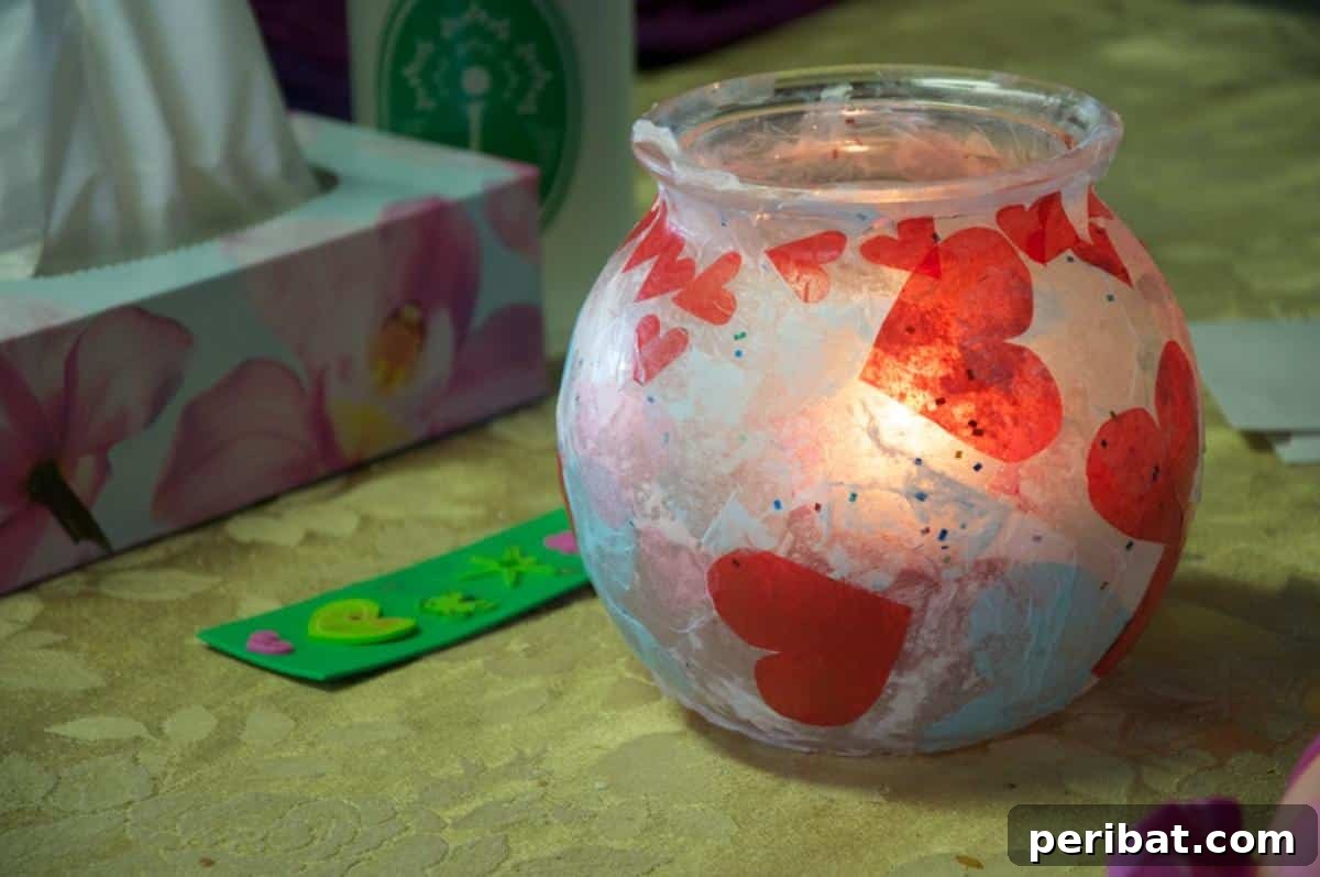 Vibrant Tissue Paper Crafts: 40 DIY Ideas 29 DIY Fish Bowl Tissue Paper Lanterns. Simple fish bowls repurposed into enchanting lanterns, adorned with layers of translucent tissue paper, creating a soft, warm glow.