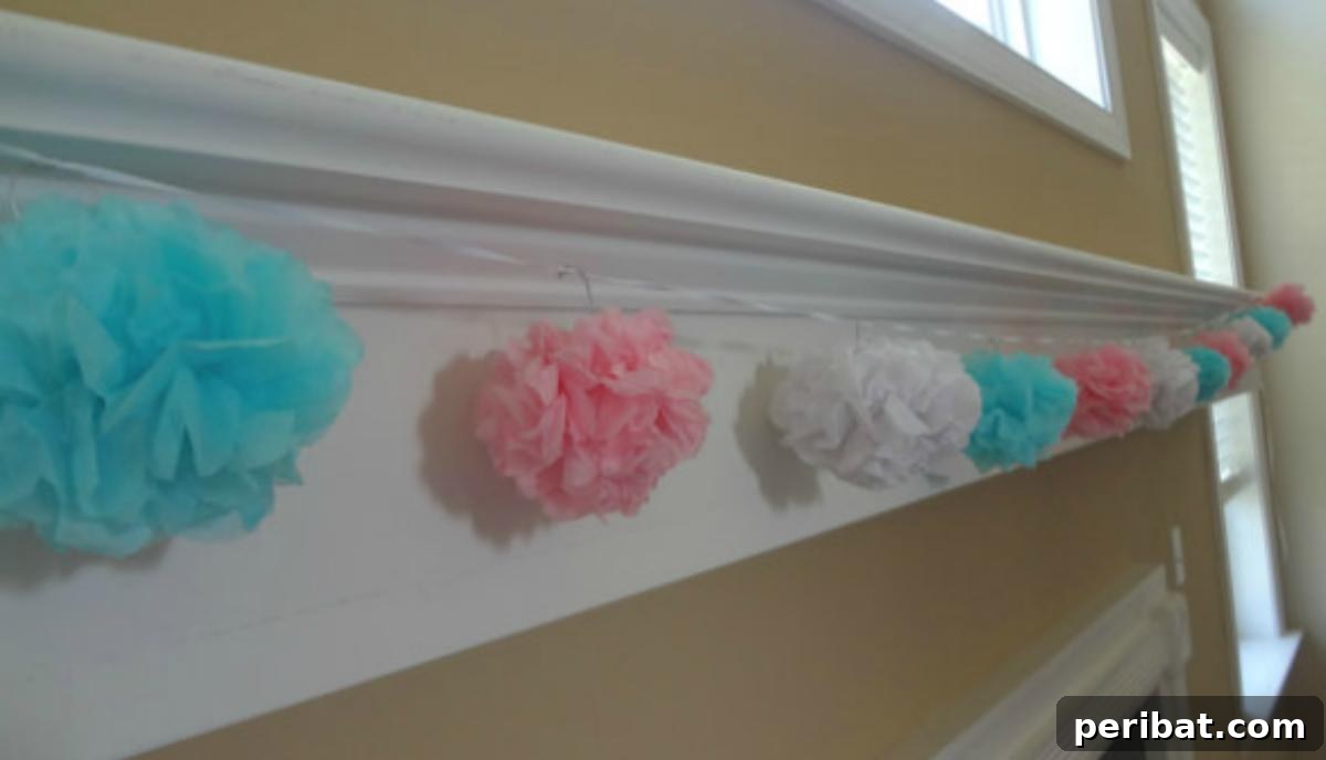 Vibrant Tissue Paper Crafts: 40 DIY Ideas 31 DIY Tissue Pom Pom Garland. A festive and colorful garland made from an assortment of fluffy tissue paper pom-poms, strung together for vibrant party decoration.