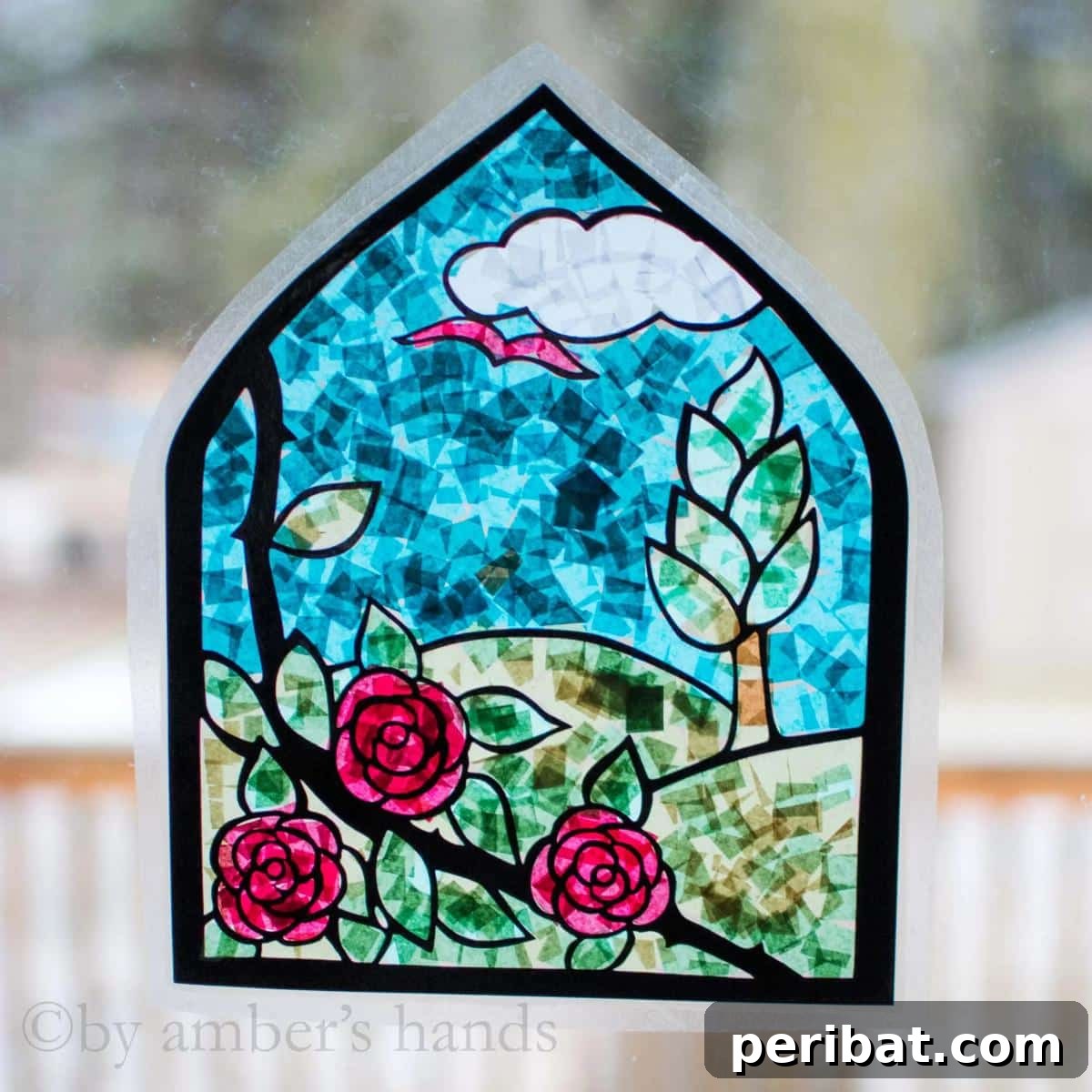 Vibrant Tissue Paper Crafts: 40 DIY Ideas 34 Stained Glass Suncatcher Craft. A vibrant and intricate suncatcher designed to mimic stained glass, made with colorful tissue paper, casting beautiful patterns when hit by sunlight.
