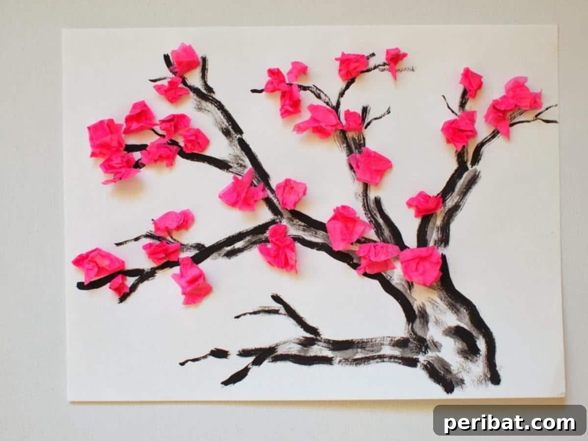 Vibrant Tissue Paper Crafts: 40 DIY Ideas 10 Cherry Blossom Tissue Paper Flower Craft. A close-up of delicate pink and white cherry blossom flowers made from tissue paper, beautifully arranged on a branch, evoking a serene spring feel.