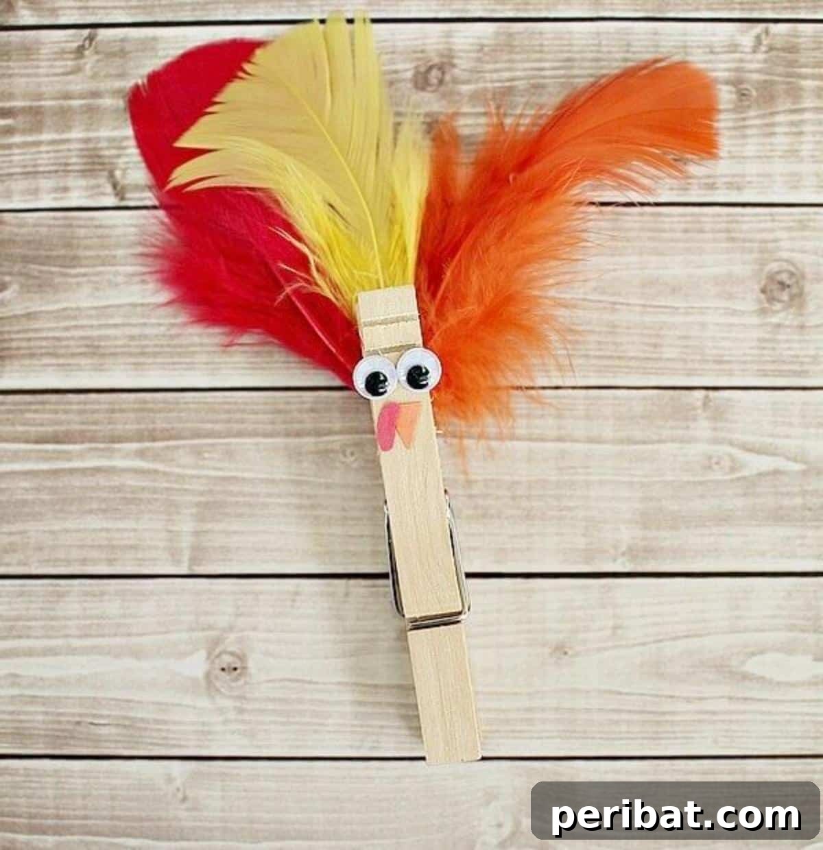 An adorable clothespin turkey craft with vibrant feathers.