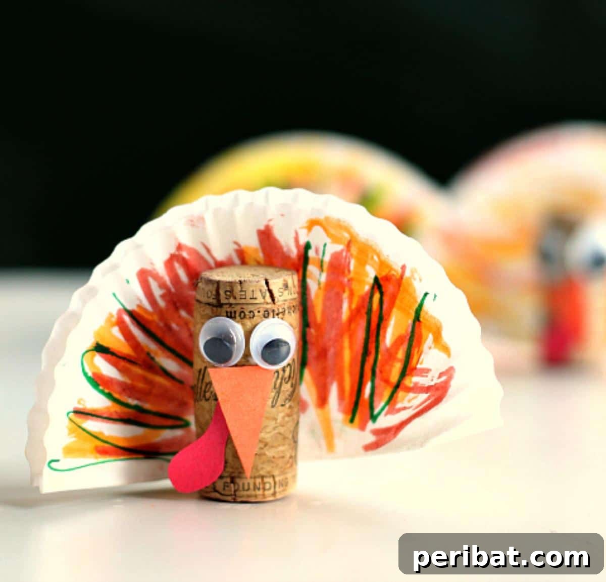 Cute cork turkeys made with colorful cupcake liners as feathers.