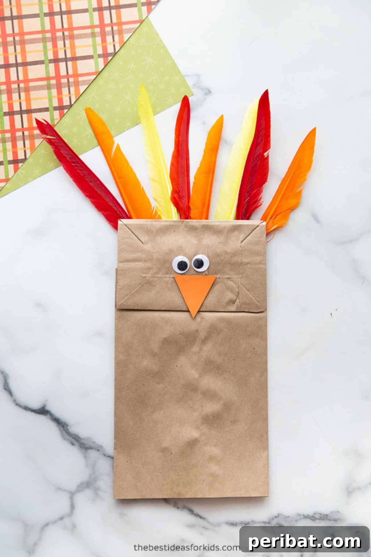 A brown paper bag turkey craft, designed for easy assembly by young children.