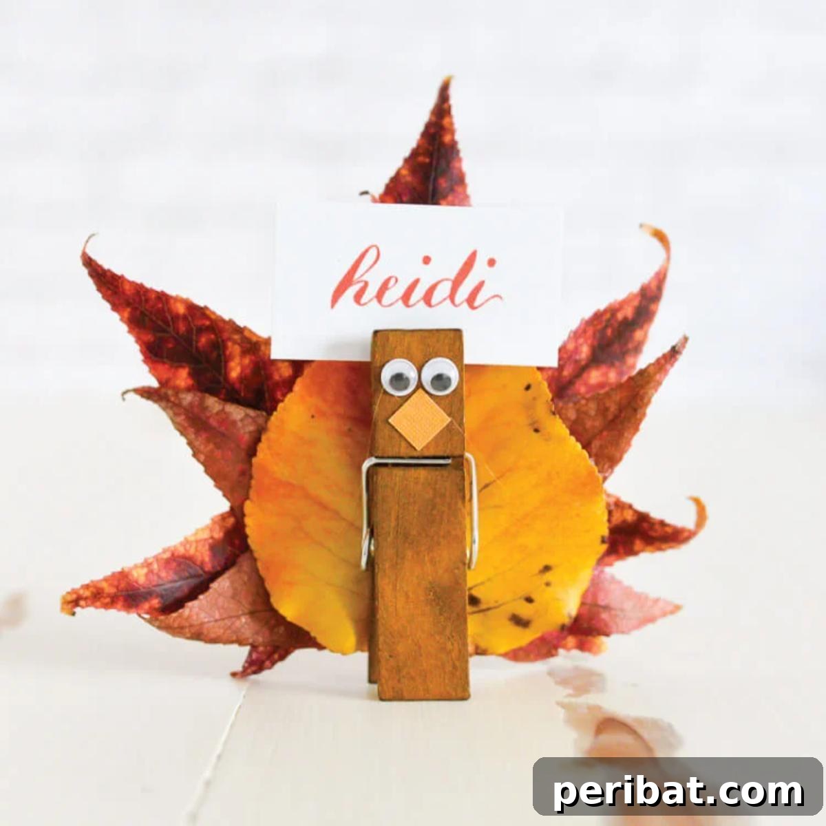 Creative turkey place card holders adorned with fall leaves and clothespins.