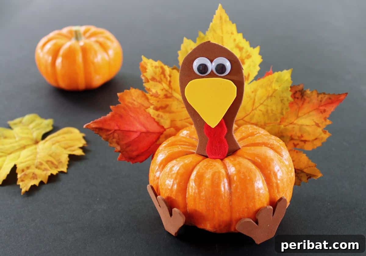 A festive pumpkin turkey craft for kids, adorned with vibrant leaves as feathers.