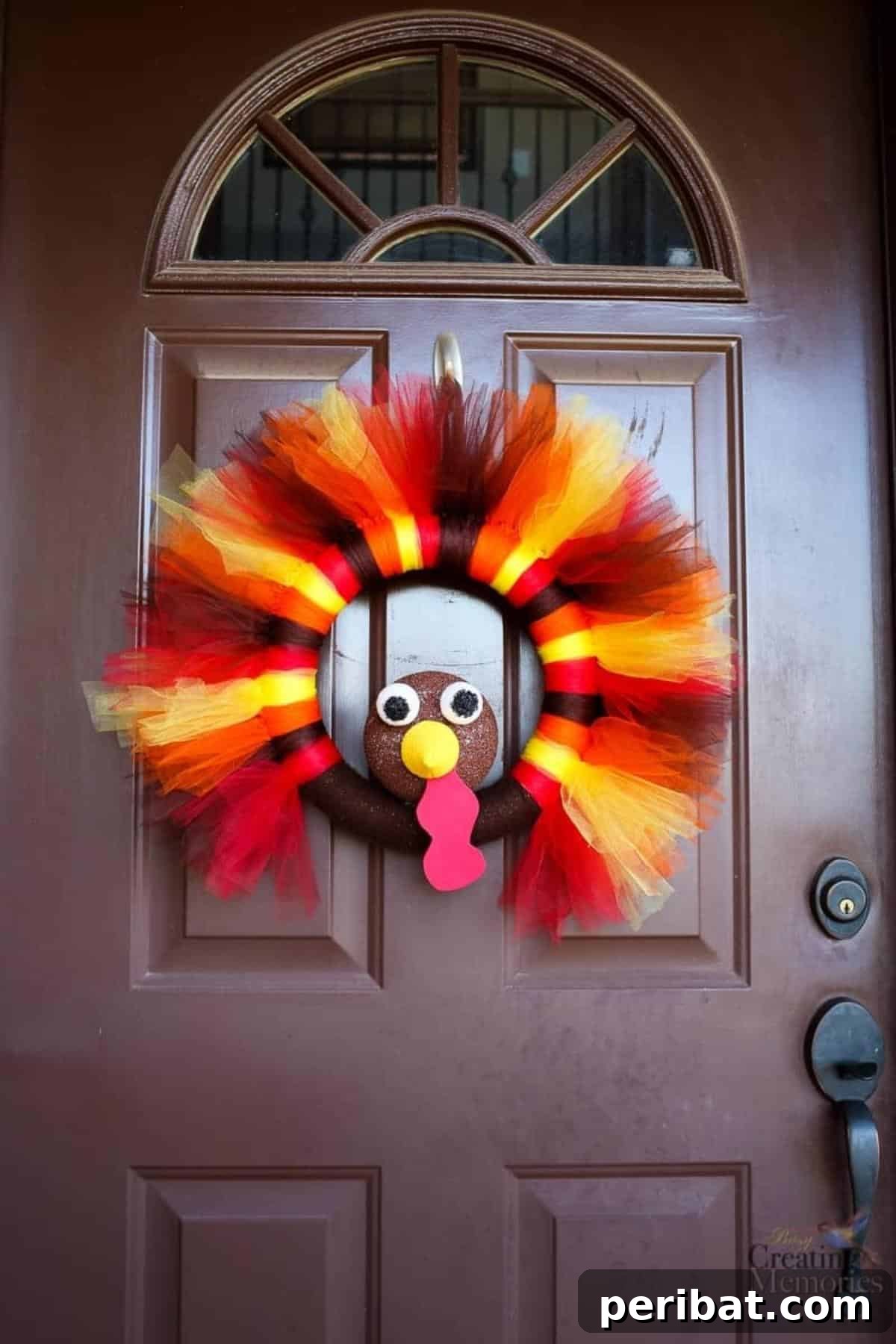 A handmade Thanksgiving turkey wreath made from colorful tulle.
