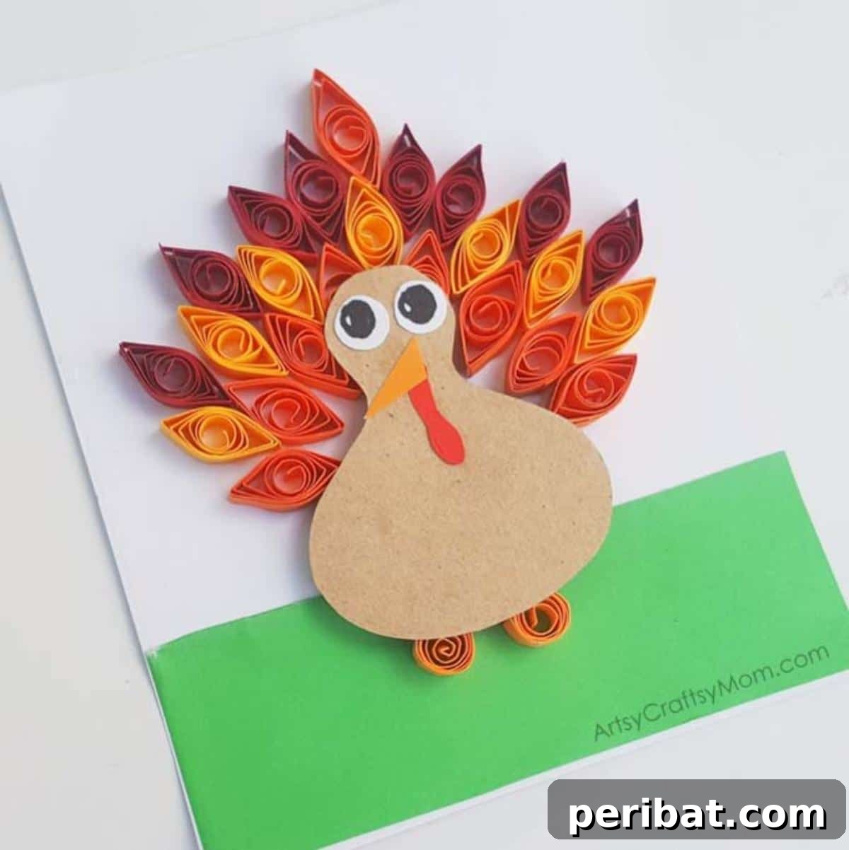 A DIY paper quilled turkey craft with colorful, textured paper strips.