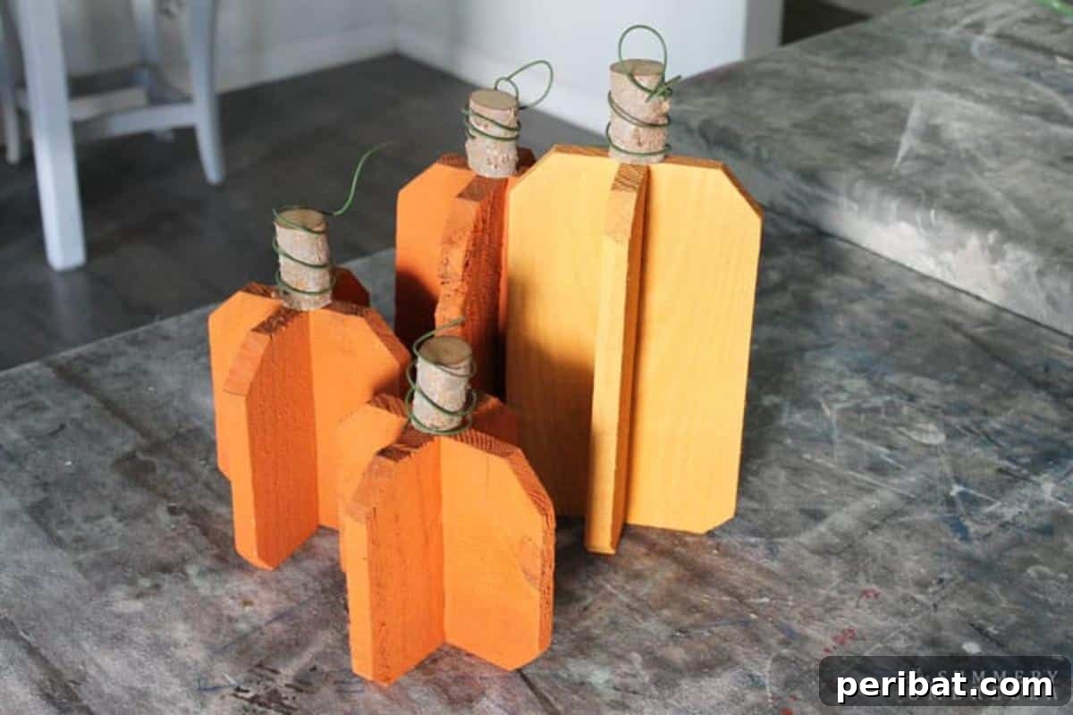 Simple Wooden Pumpkin Crafts for Autumn Decor 7 Chic reclaimed wood pumpkins for rustic fall styling.