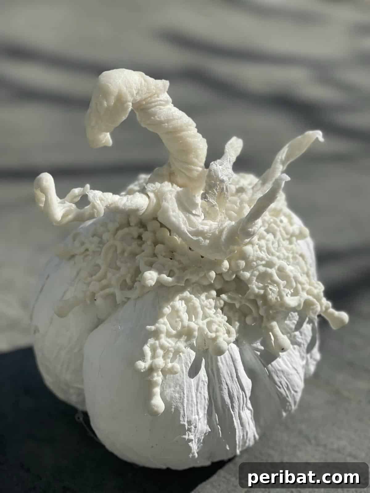 33 Creative Paper Mache Pumpkin Ideas 12 A stunning paper mache pumpkin, crafted with elegance and subtle embellishments for a chic fall look.