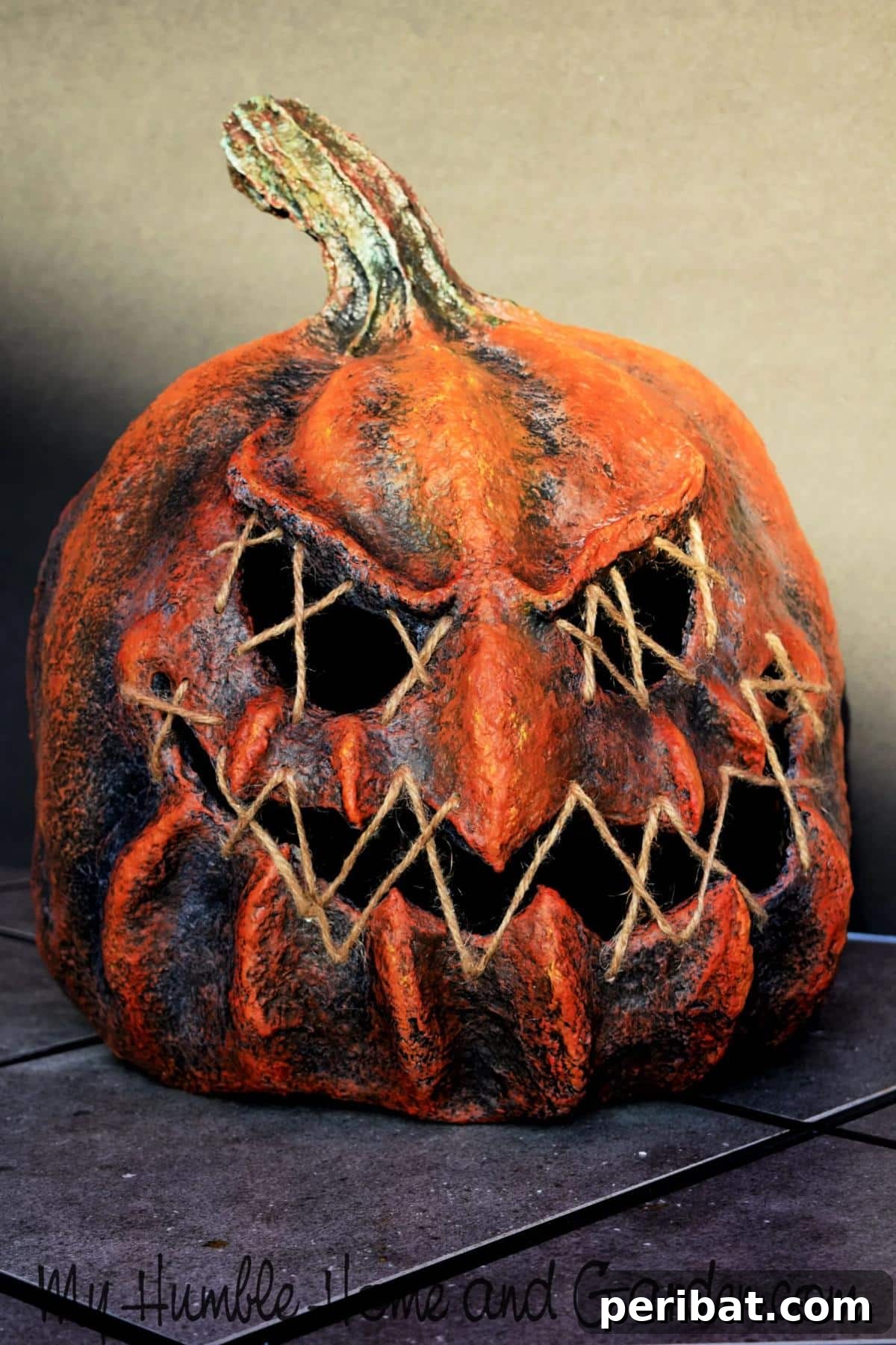 33 Creative Paper Mache Pumpkin Ideas 17 A uniquely textured paper mache pumpkin, shaped with jute twine to add distinct character to fall decor.