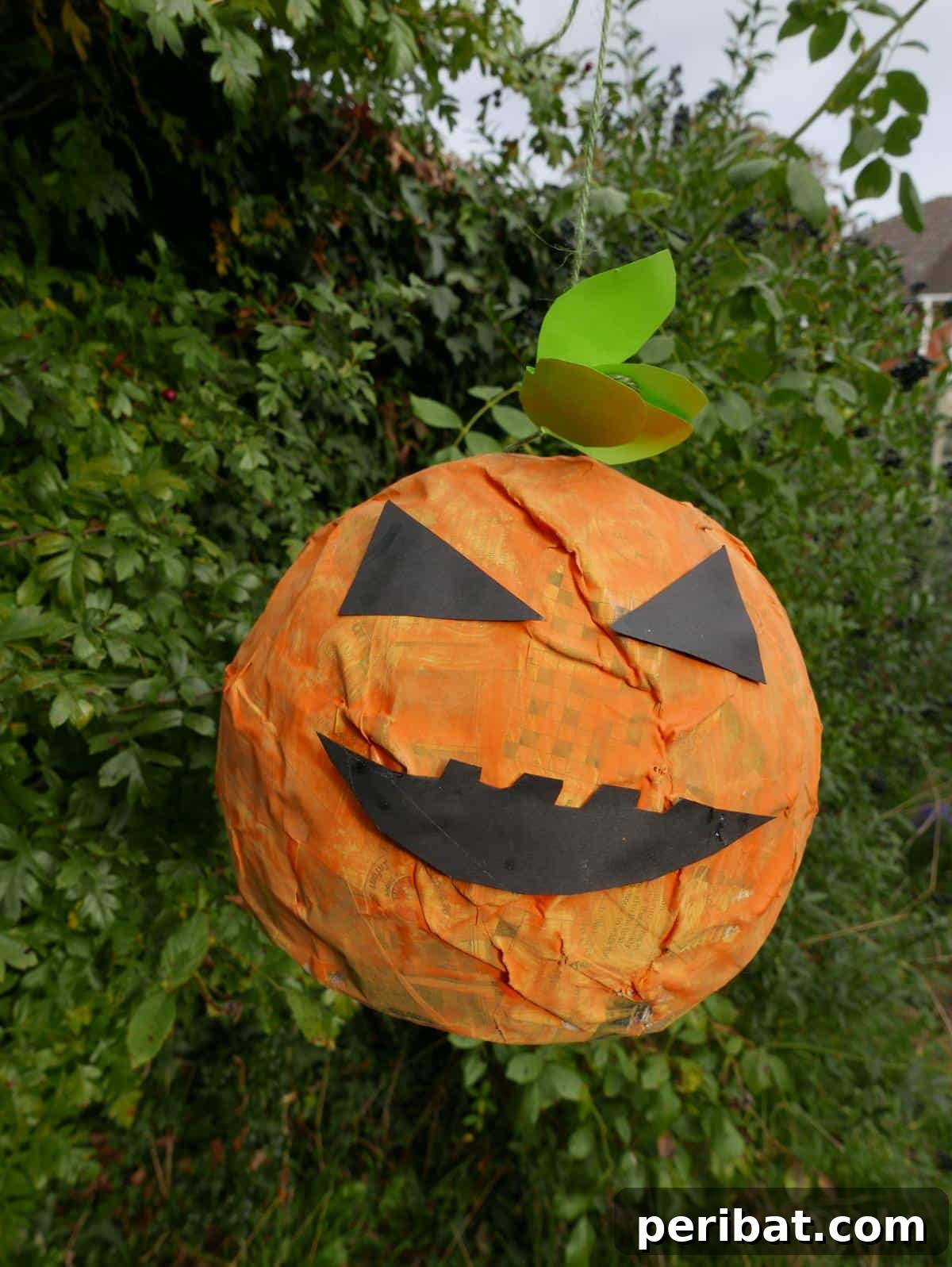 33 Creative Paper Mache Pumpkin Ideas 20 A festive Paper Mache Pumpkin Pinata, ready to be a fun party game or cheerful centerpiece for Halloween or fall.