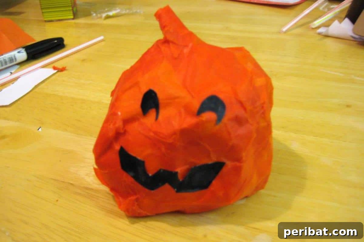33 Creative Paper Mache Pumpkin Ideas 25 A straightforward Simple Paper Mache Pumpkin, ideal for creating basic yet beautiful fall decorations with ease.