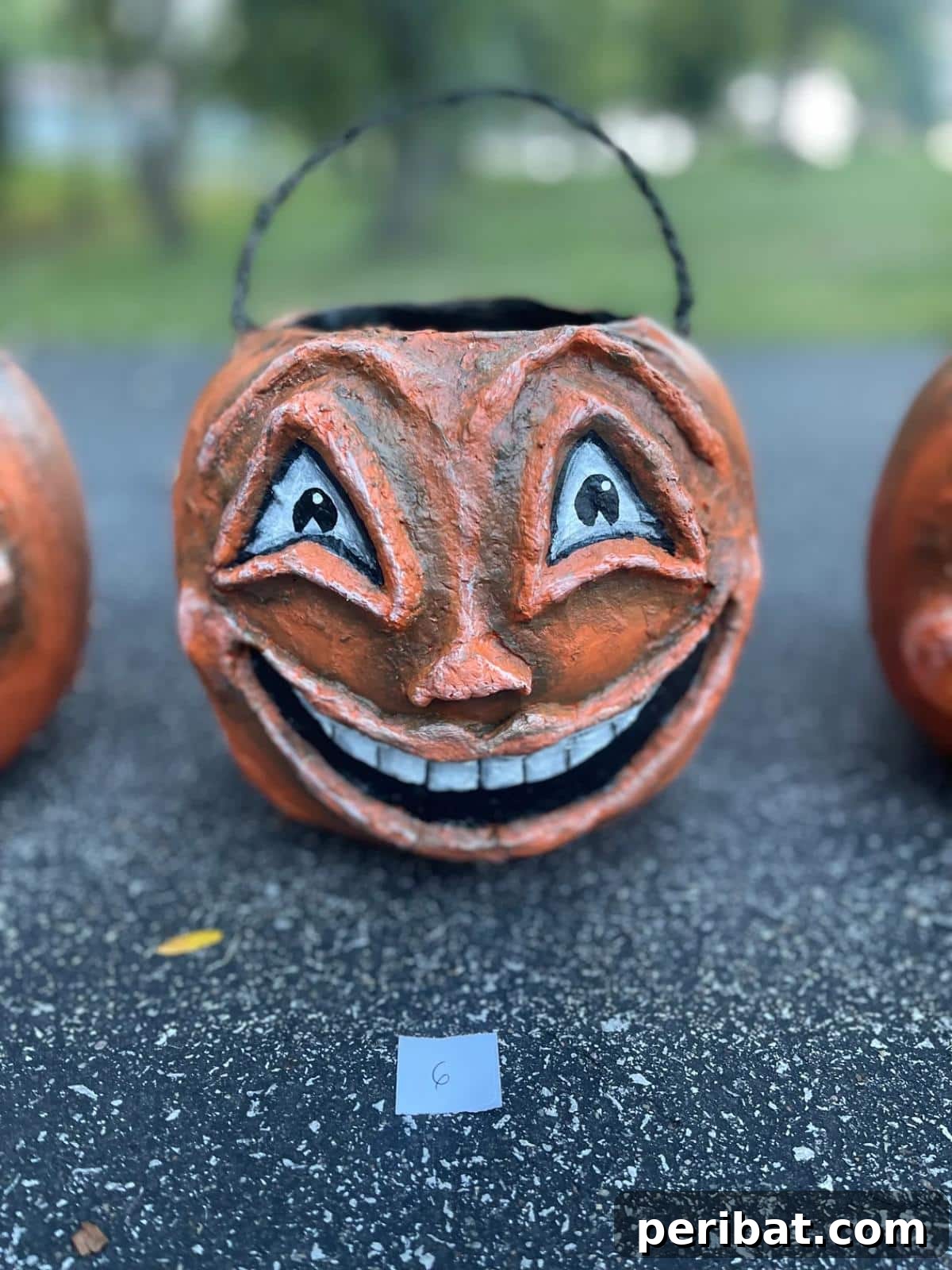 33 Creative Paper Mache Pumpkin Ideas 34 A versatile Pumpkin Paper Mache Bucket, perfect as a decorative piece and a functional treat holder for Halloween.