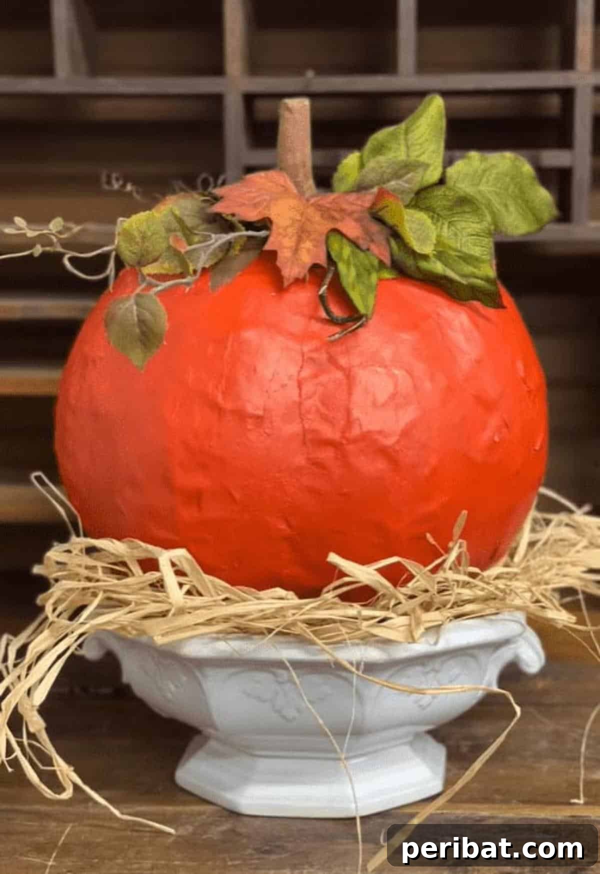 33 Creative Paper Mache Pumpkin Ideas 6 An easy-to-make paper mache pumpkin, ideal for beginners seeking a whimsical or spooky fall decoration.