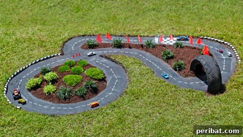 Intricately designed DIY racetrack for toy cars in a backyard