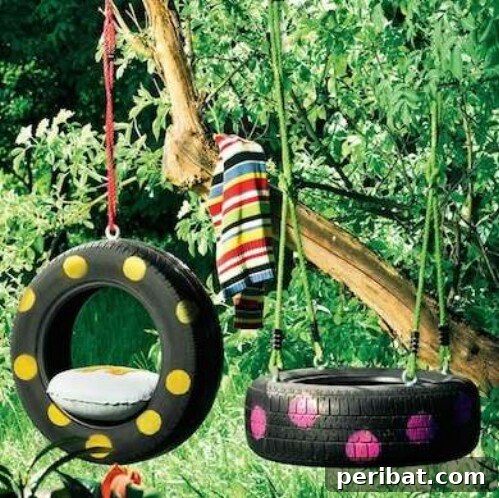 Vibrantly painted DIY tire swing with polka dots hanging from a tree