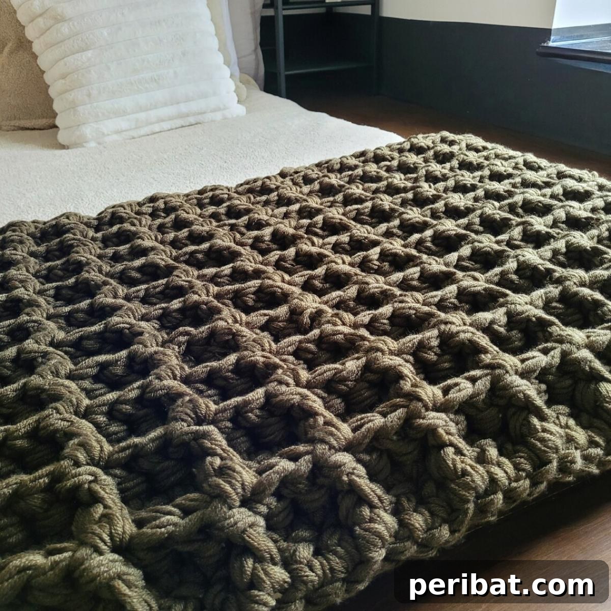 28 Soothing DIY Weighted Blanket Projects 28 A beautifully textured Weighted Blanket Crochet Pattern, showcasing intricate stitches and a comforting design.