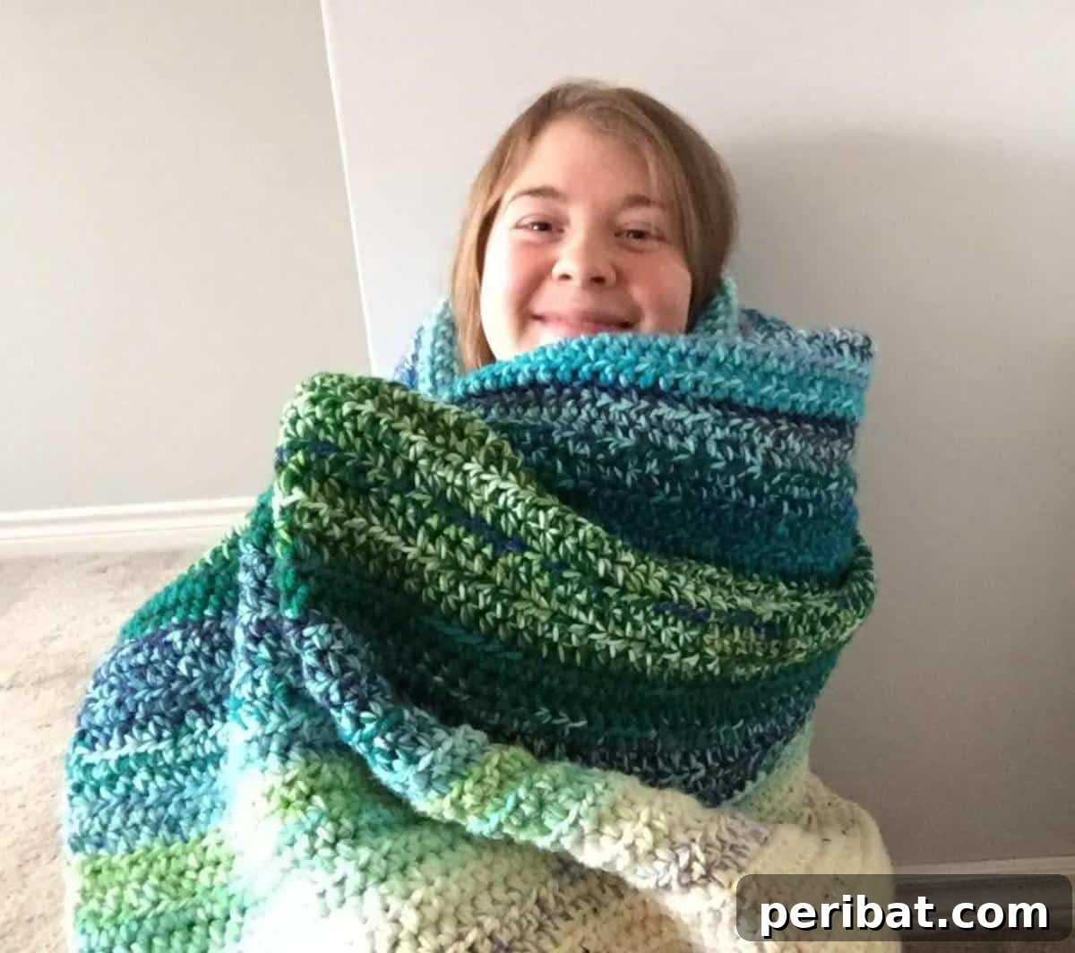 28 Soothing DIY Weighted Blanket Projects 5 A vibrant, crocheted Easy Weighted Rainbow Blanket displaying a beautiful spectrum of colors and comforting texture.