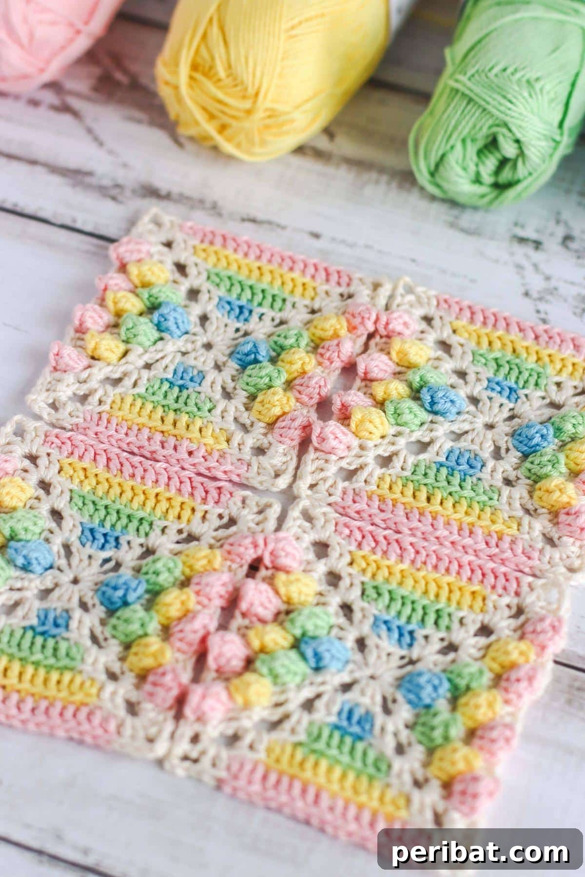 A vibrant Rainbow Gumdrop Granny Square, showcasing colorful textures and a playful design.