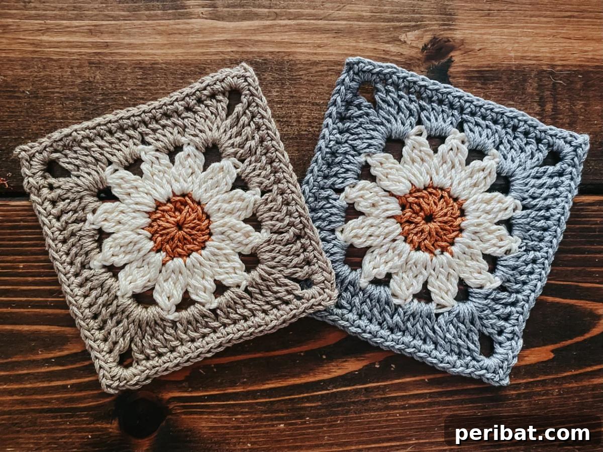 A cheerful Daisy Granny Square, featuring white petals and a sunny yellow center.