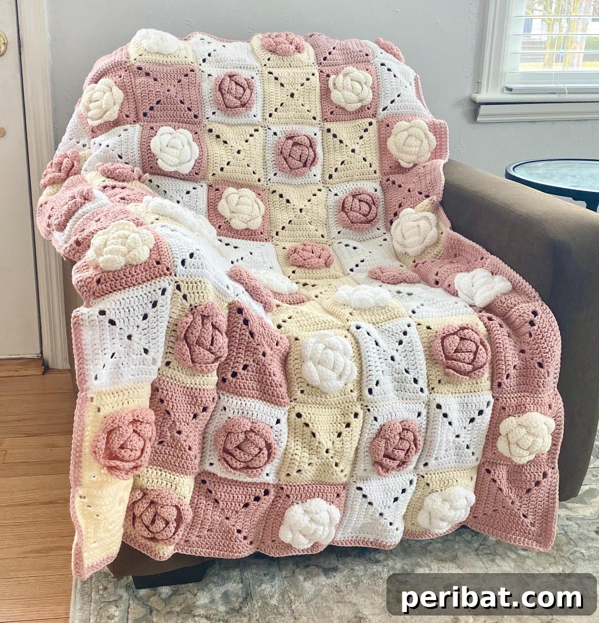 A close-up of a Rose Granny Square, showing delicate petals and a rich, floral texture.