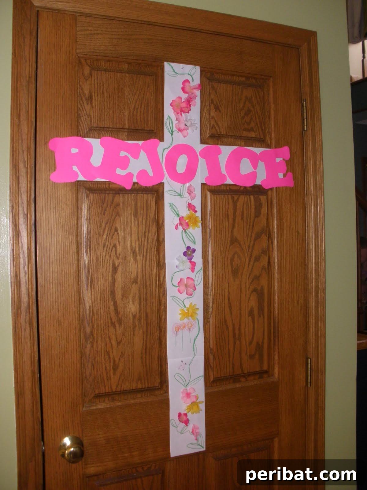 A DIY Easter cross adorned with vibrant spring flowers.