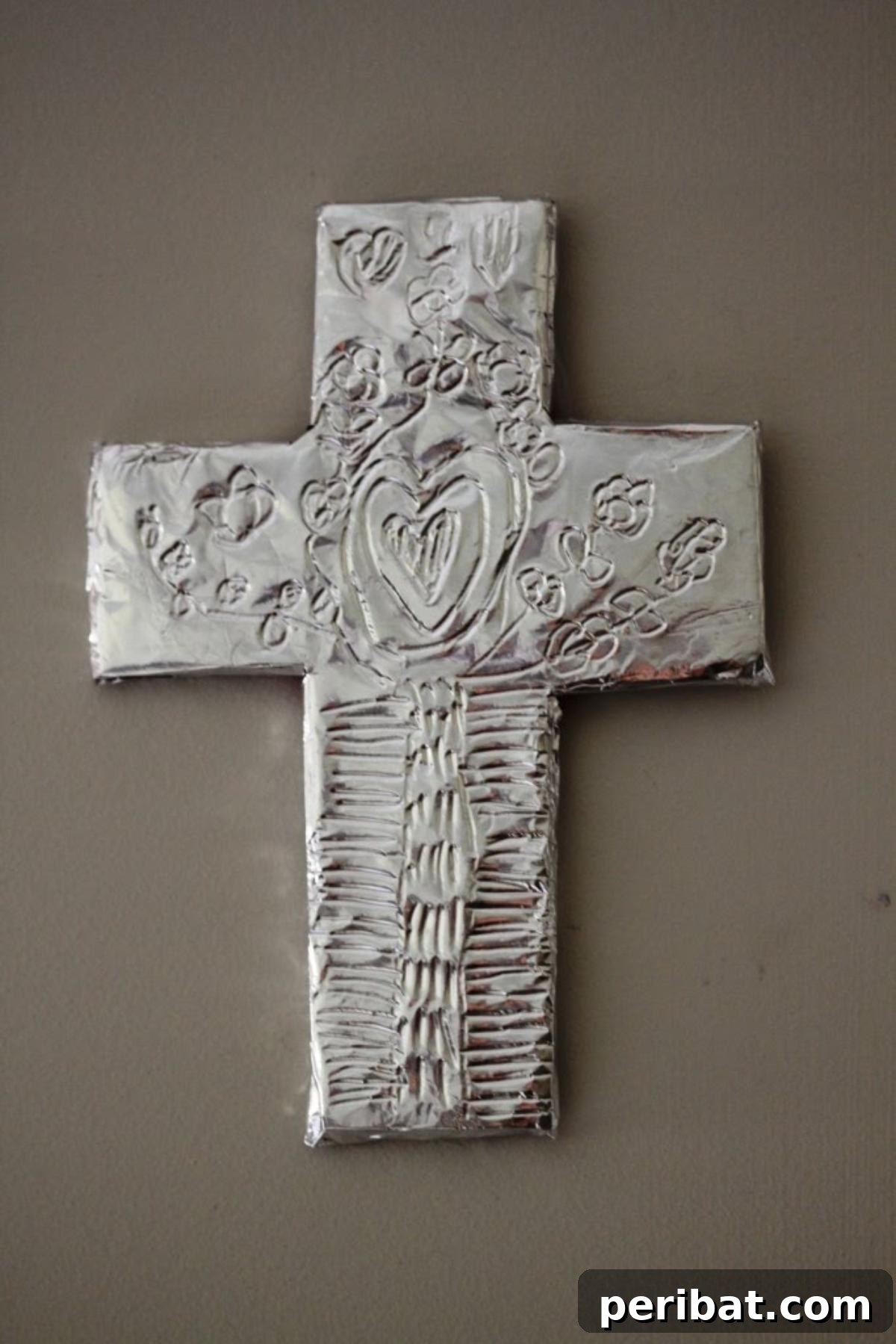 Good Friday cross craft made from foil and a foam sheet.