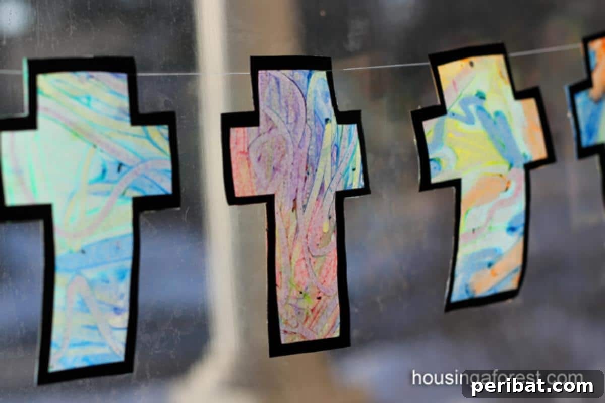 A melted crayon cross art piece resembling stained glass.