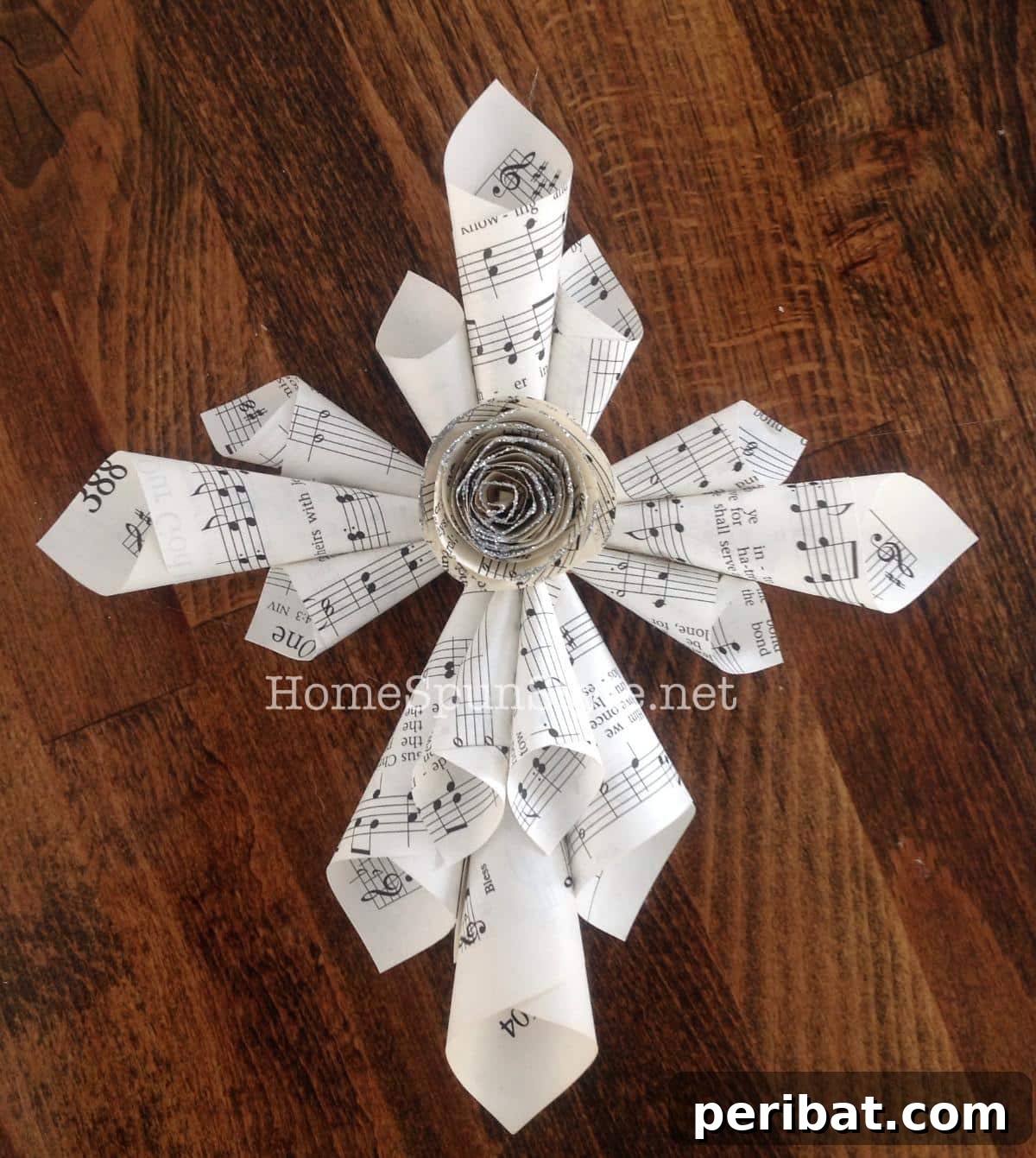 Mini paper hymnal cross DIY, intricately folded from old hymnal pages.