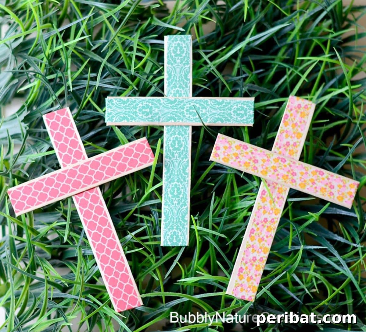 A cross decorated with colorful and patterned Washi tape.