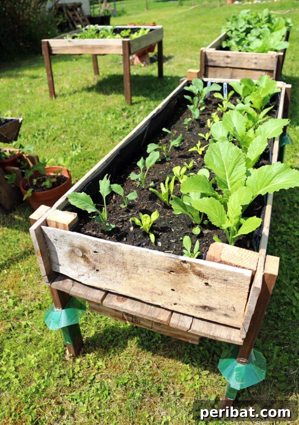 From Pallets to Paradise 40 Garden Furniture and Decor DIYs 25 Elevated Pallet Planter Boxes