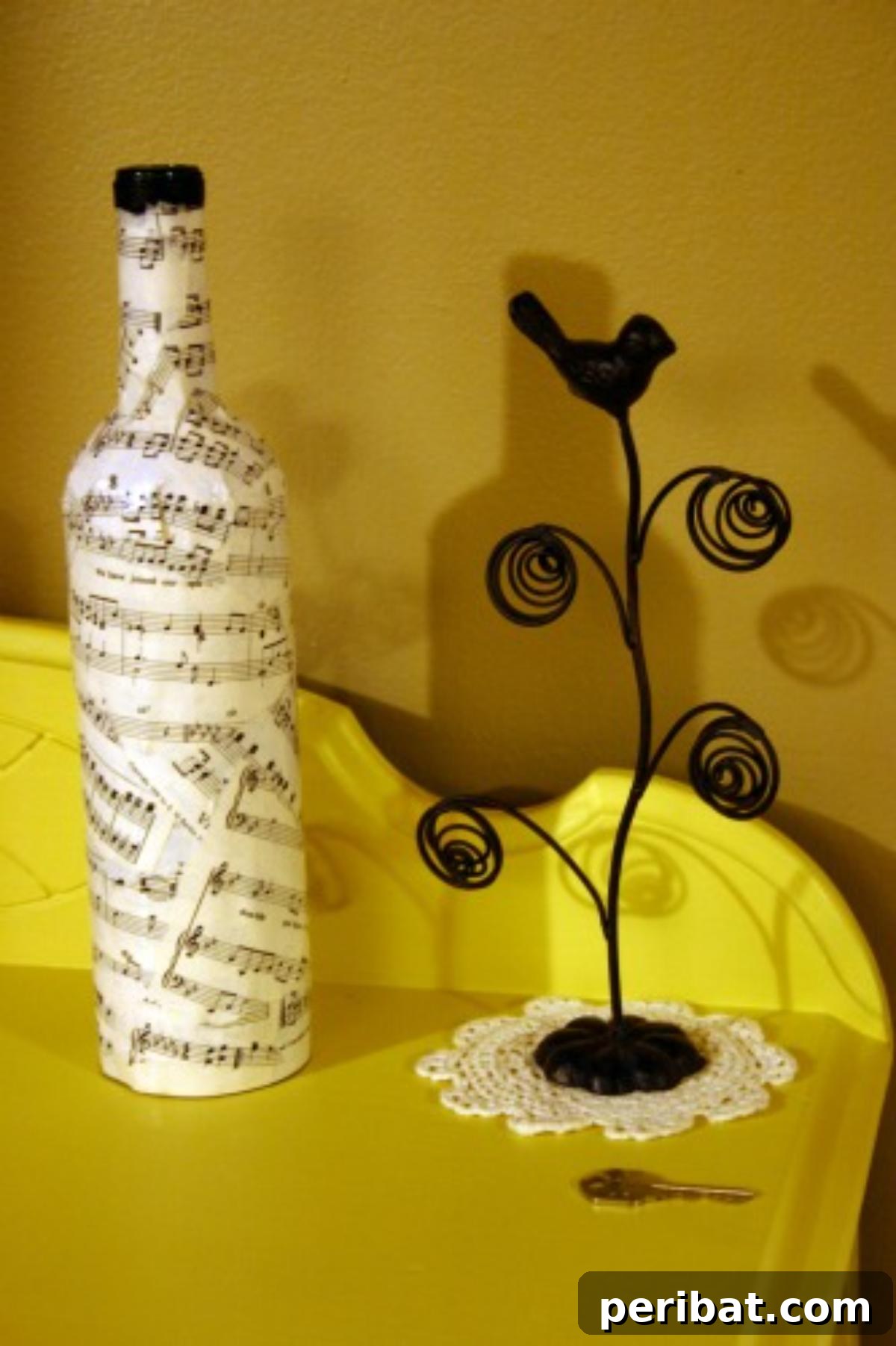 Crafting Melodies 40 Sheet Music Projects 12 An old bottle artfully covered with sheet music, transformed into a decorative item.