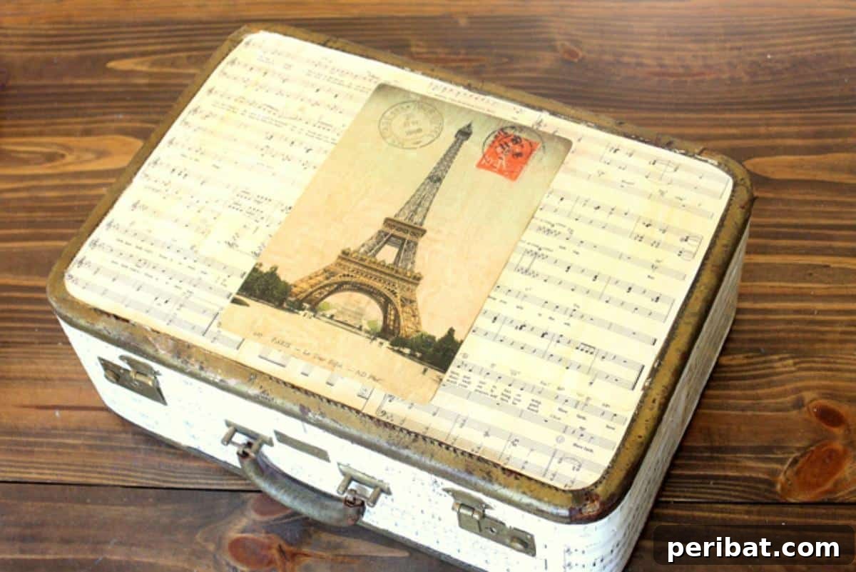 Crafting Melodies 40 Sheet Music Projects 15 A DIY sheet music covered suitcase, repurposed as a decorative storage solution.