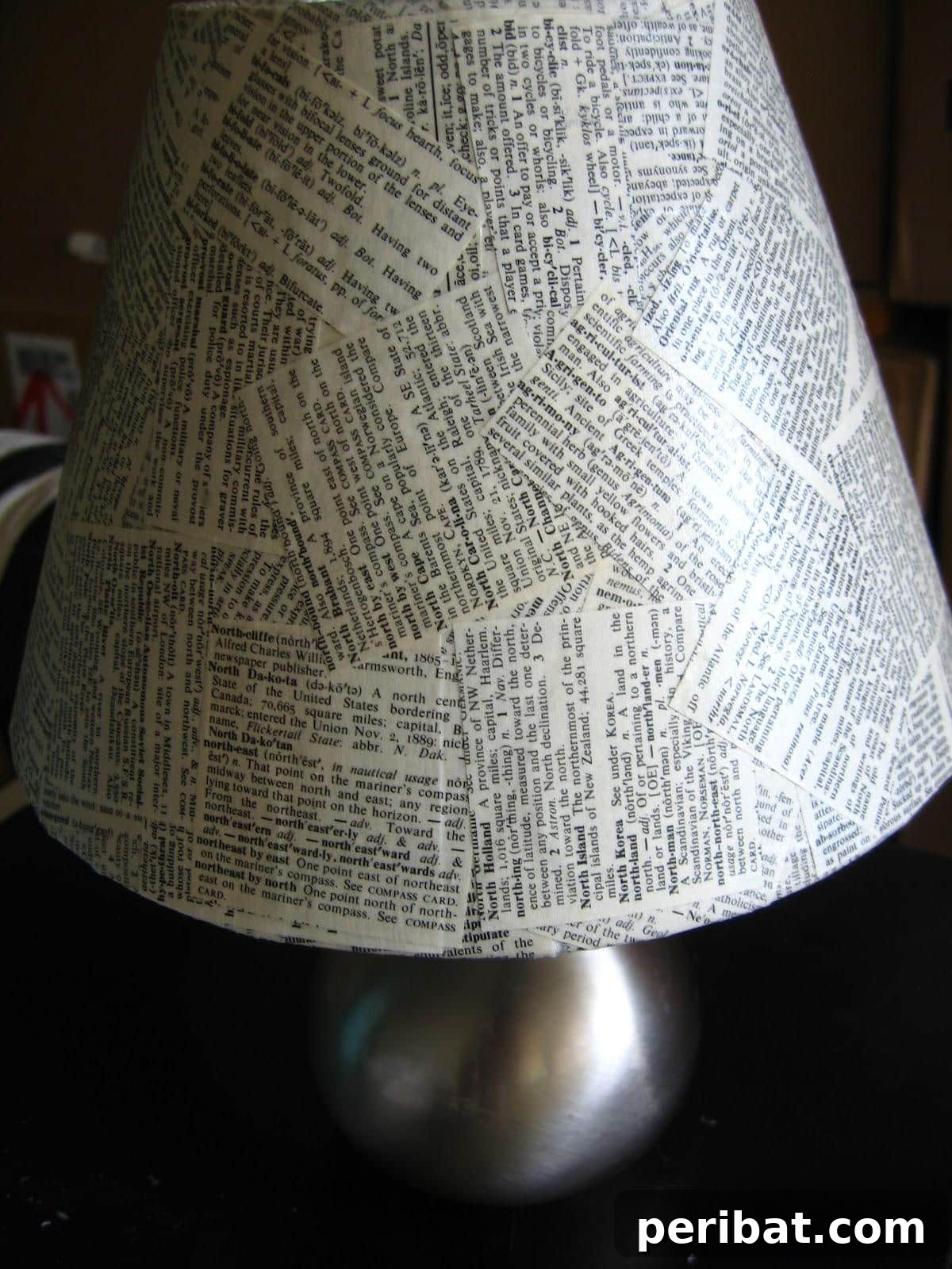 Crafting Melodies 40 Sheet Music Projects 18 A budget-friendly Anthropologie-inspired lampshade made with sheet music, casting a soft, warm light.