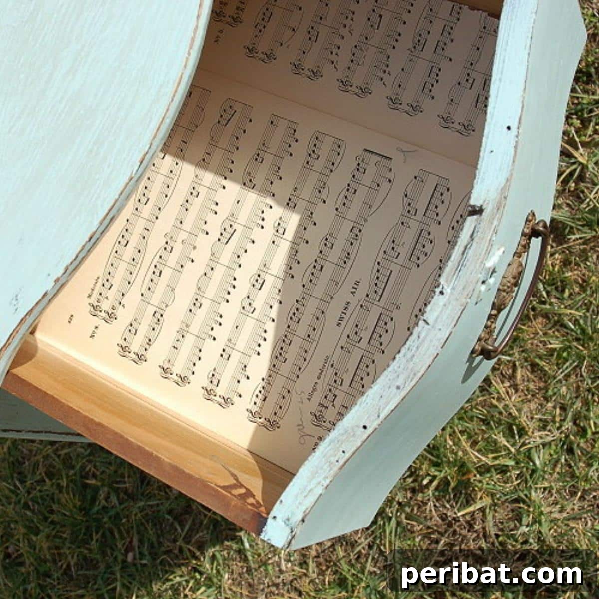 Crafting Melodies 40 Sheet Music Projects 25 A drawer ingeniously lined with sheet music, adding a unique and elegant touch to furniture.