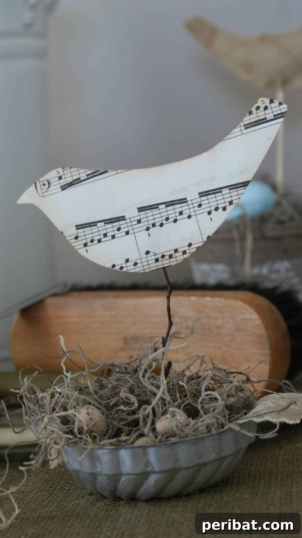 Crafting Melodies 40 Sheet Music Projects 29 A delicately crafted sheet music bird, perched as an elegant ornament.