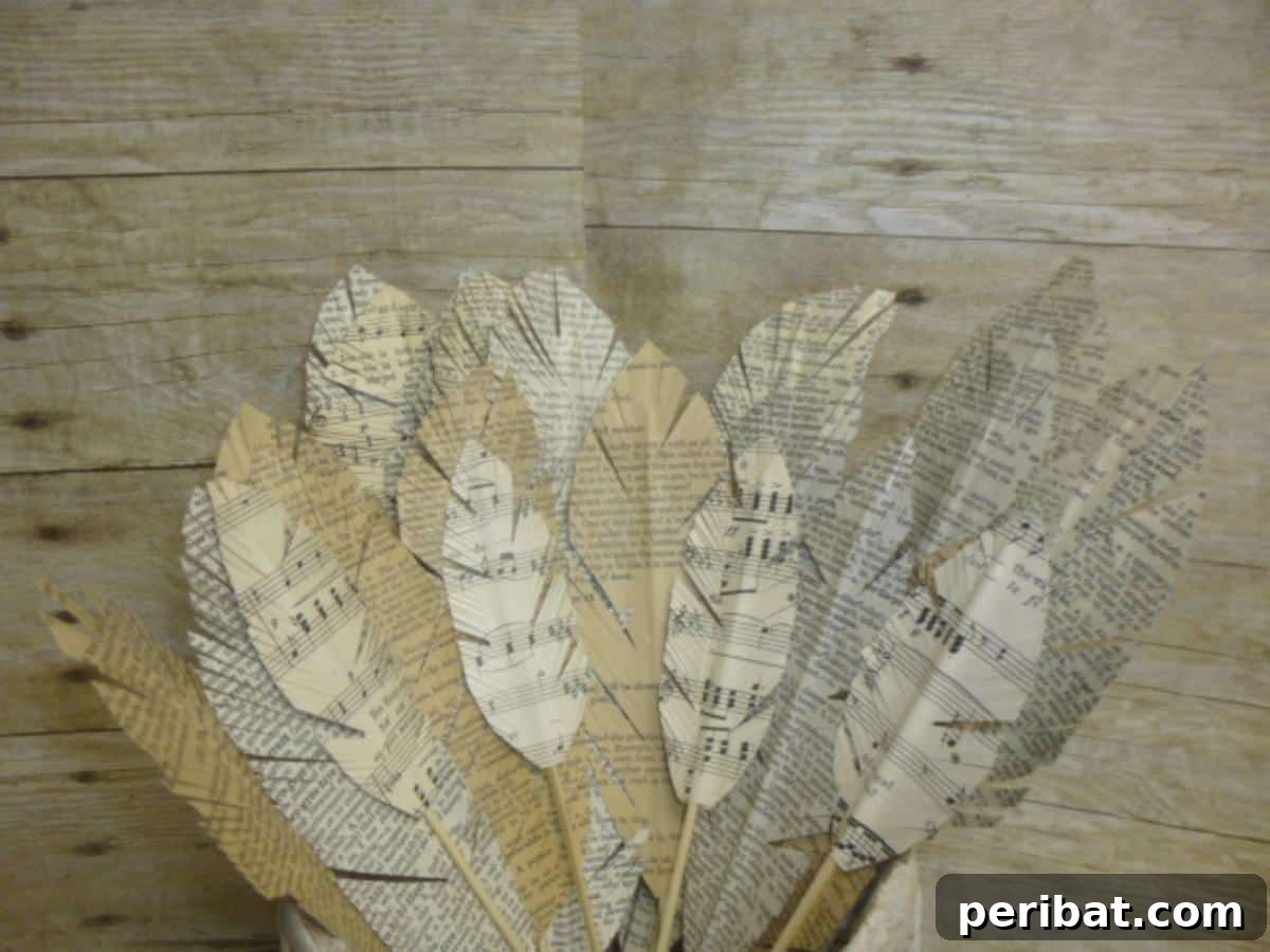 Crafting Melodies 40 Sheet Music Projects 30 Delicate sheet music feathers, artfully cut and shaped, showcasing musical notes.