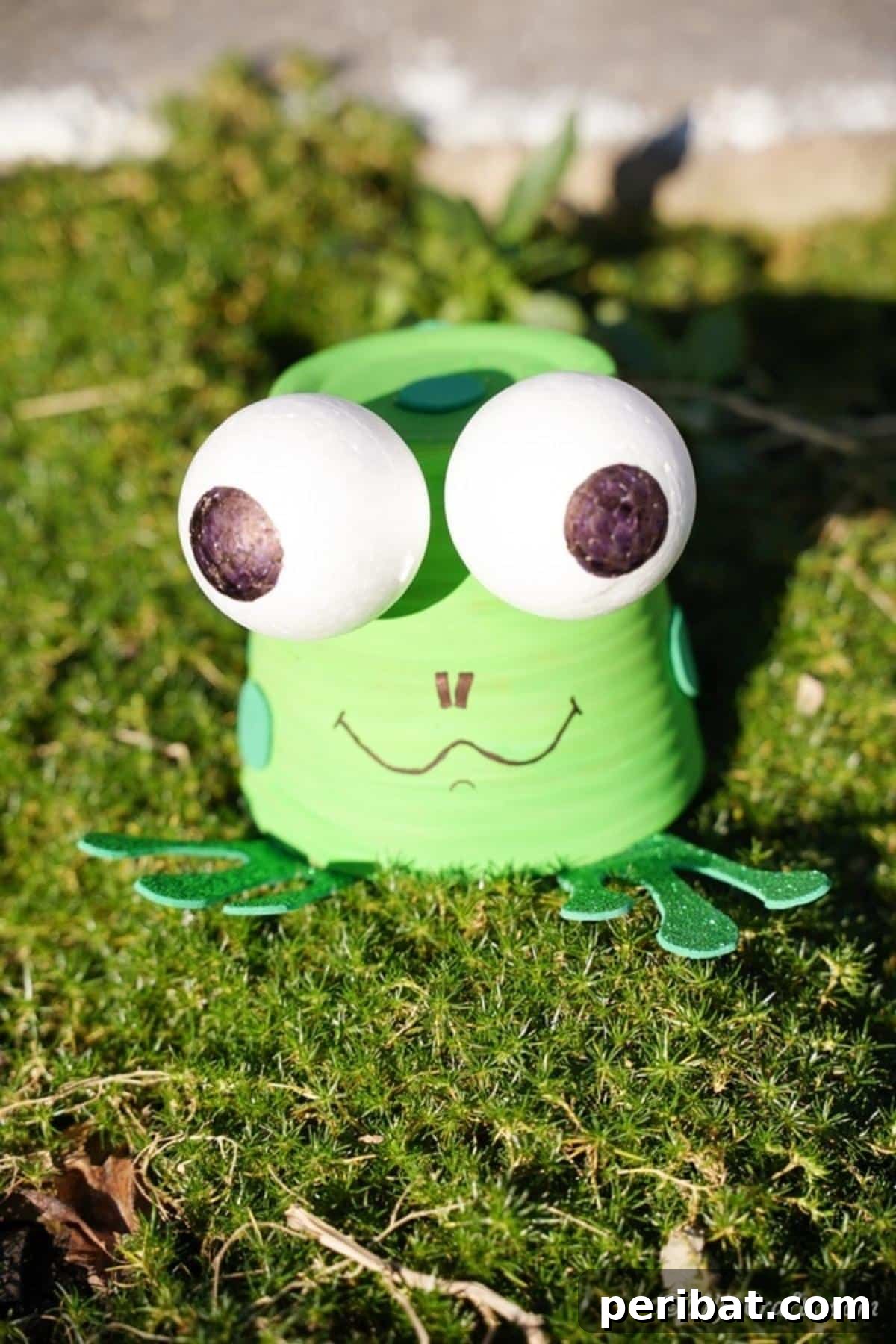 40 Creative Flower Pot Projects 11 A whimsical upcycled flower pot frog decoration, ideal for adding a playful and unique touch to any garden.