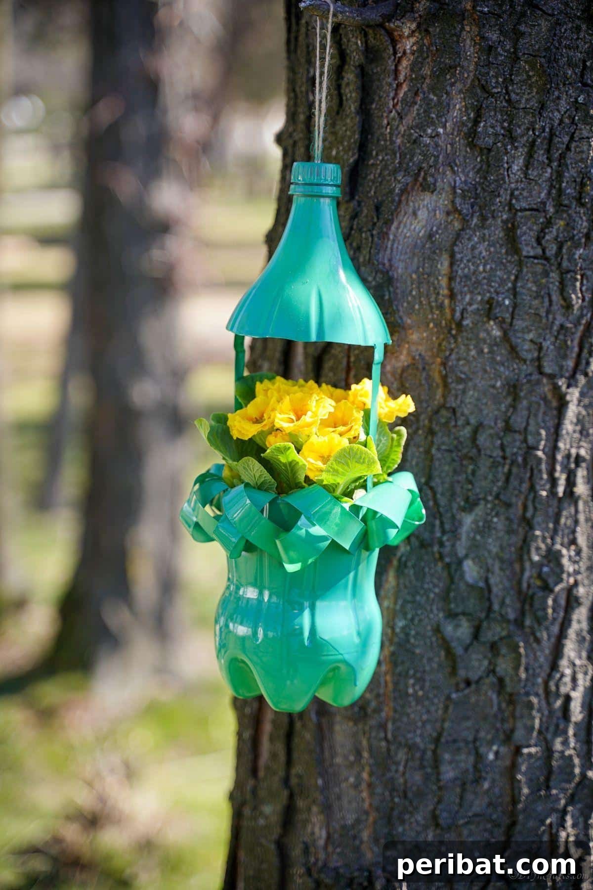 40 Creative Flower Pot Projects 15 A clever hanging flower pot made from an upcycled soda bottle, promoting sustainable gardening.