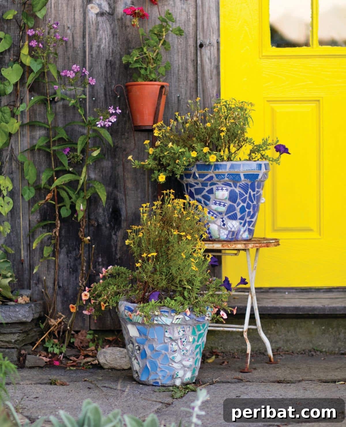 40 Creative Flower Pot Projects 22 Vibrantly decorated mosaic flower pots, adding artistic flair and a splash of color to any garden or patio.