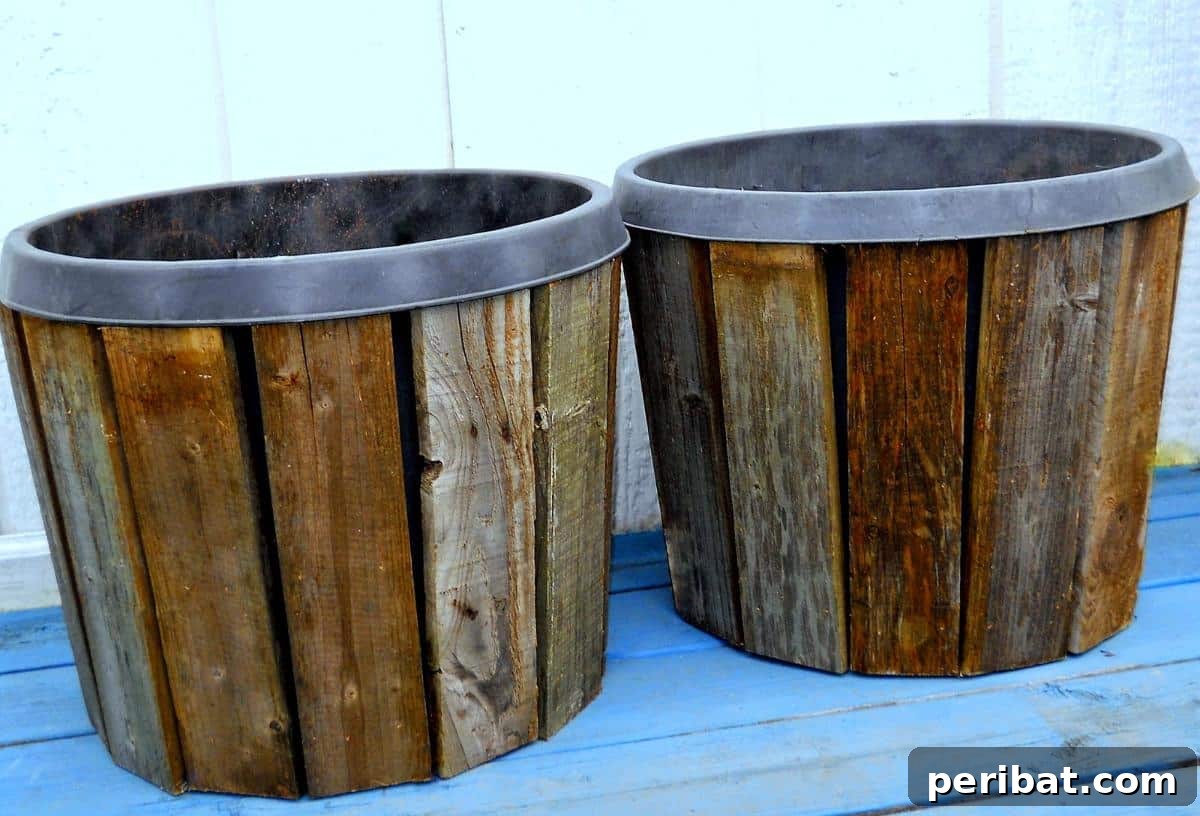 40 Creative Flower Pot Projects 31 Rustic DIY pallet wood planter covers, adding natural charm and an eco-friendly touch to garden decor.