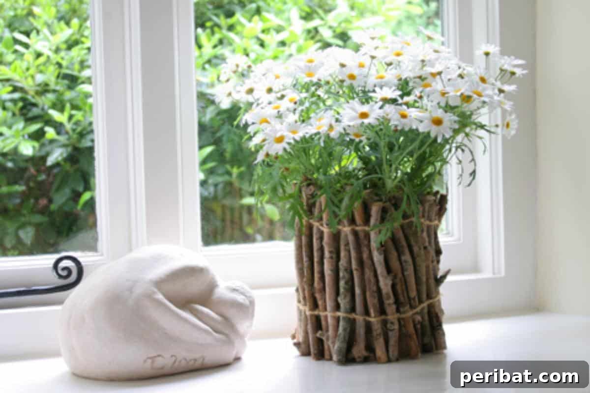 40 Creative Flower Pot Projects 33 An rustic twig flower pot, created using natural materials, with a helpful tutorial for assembly.