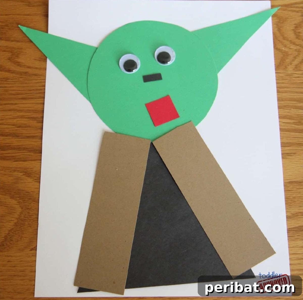 A craft project of Yoda made from various geometric shapes, teaching kids about shapes and colors.
