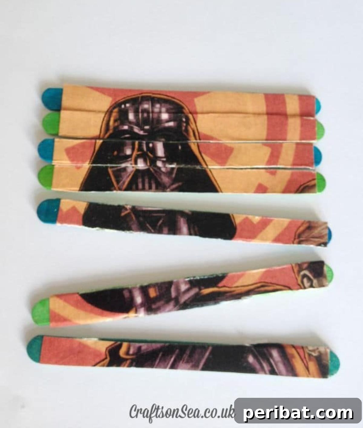 A Darth Vader puzzle made from painted craft sticks, assembled to show his helmet.