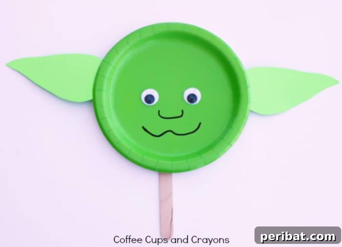 A handcrafted Yoda puppet, suitable for imaginative play or as a decoration.