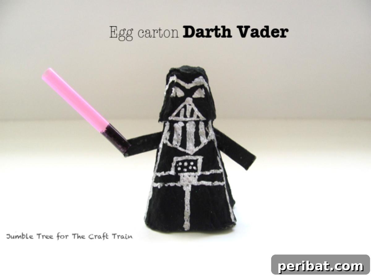 A miniature Darth Vader figure crafted from a recycled egg carton, painted black.
