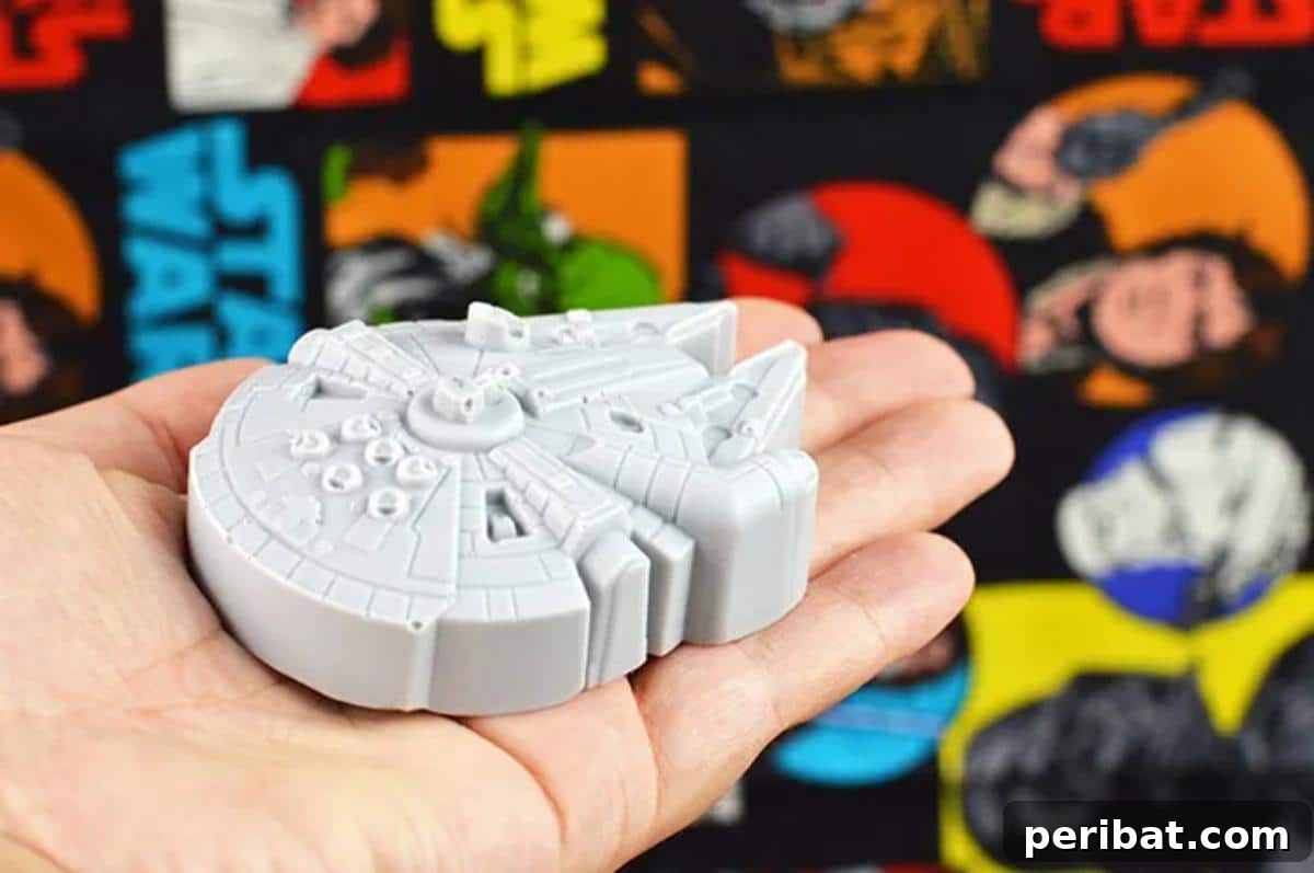 Handmade soap shaped like the Millennium Falcon, perfect for a Star Wars themed bathroom.